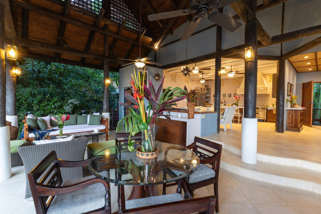 This villa offers a spacious lounge and living area, with ocean breezes and ceiling fans.
