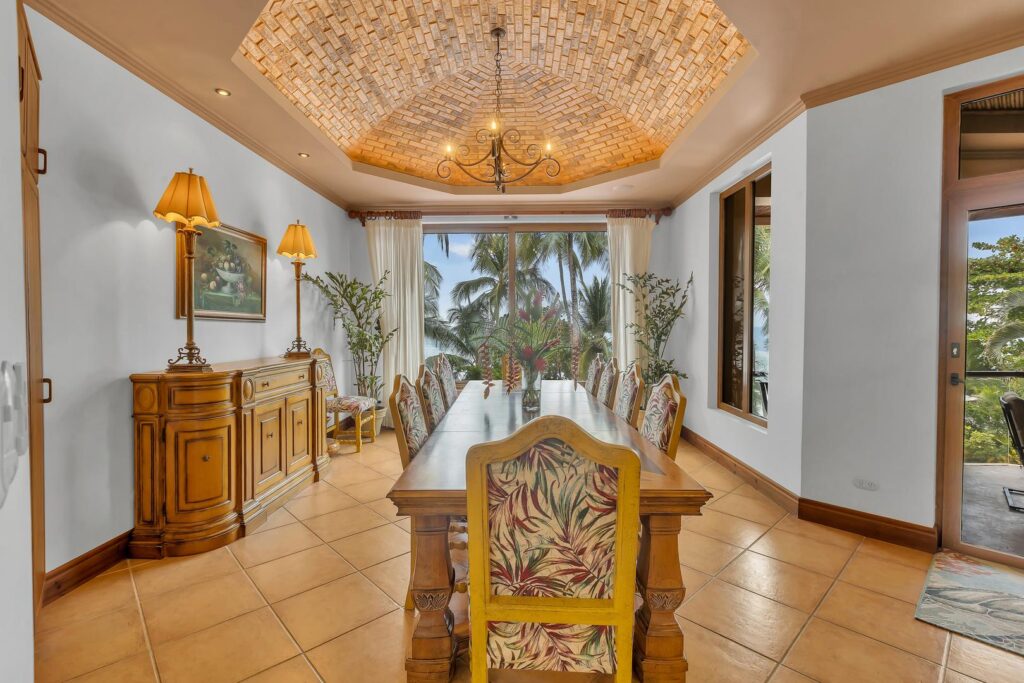 Enjoy memorable meals with family and friends in the elegant dining room, where handcrafted furnishings and Pacific Ocean views create a welcoming atmosphere.
