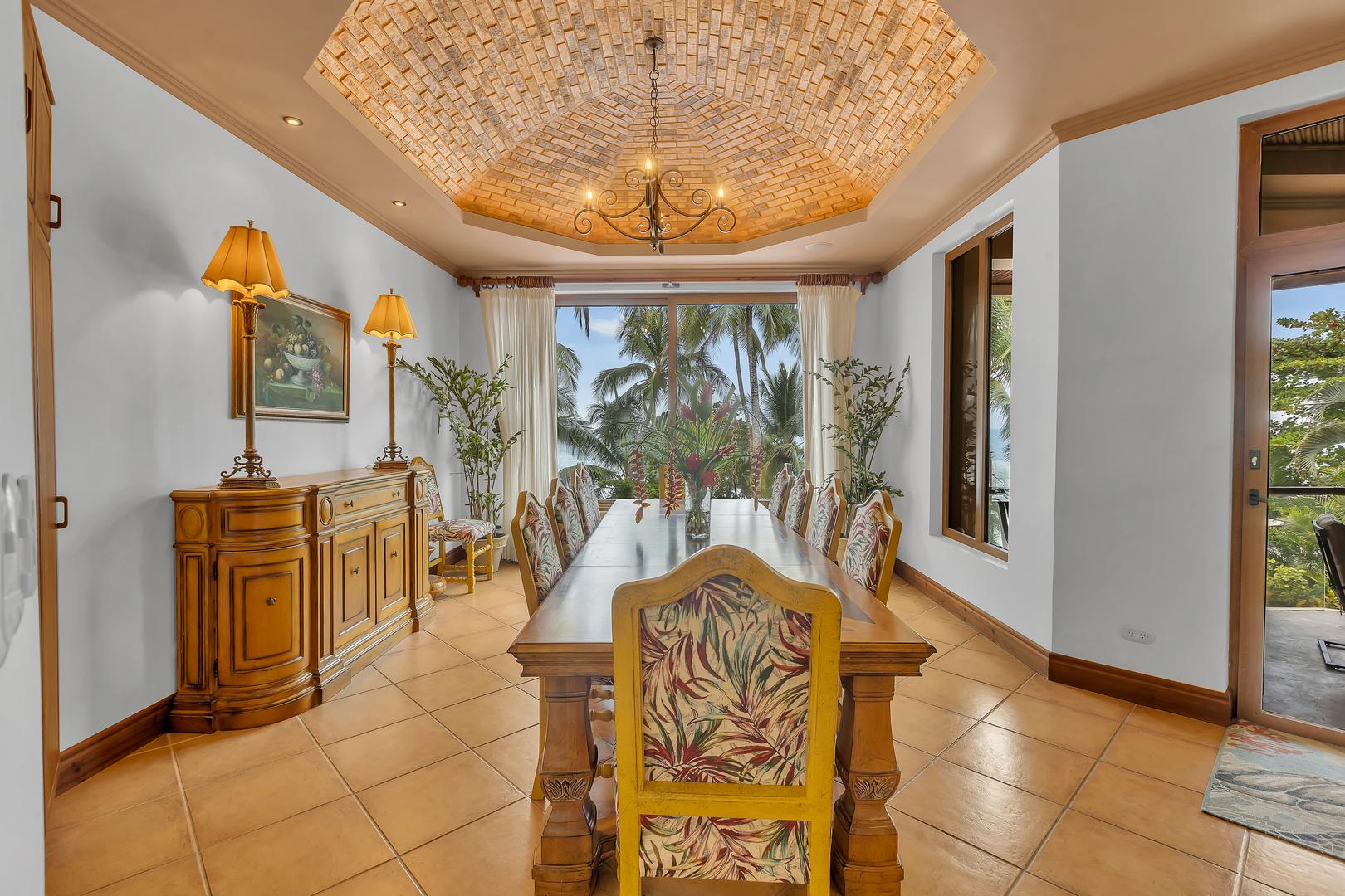 Formal dining room with ocean views at a luxury beachfront vacation villa in Playa Tambor, Costa Rica.