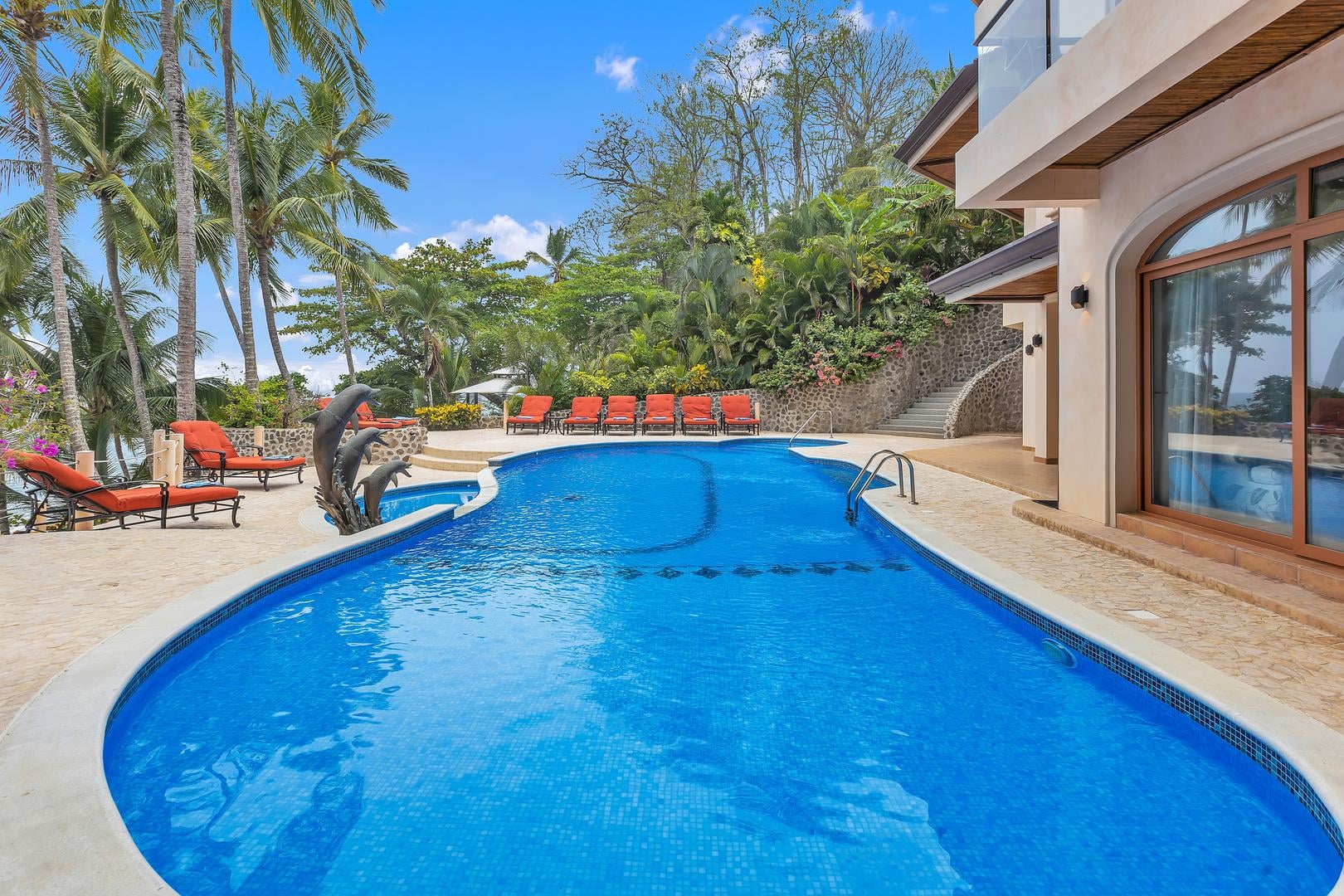 Private beachfront swimming pool at a luxury vacation villa in Playa Tambor, Costa Rica.