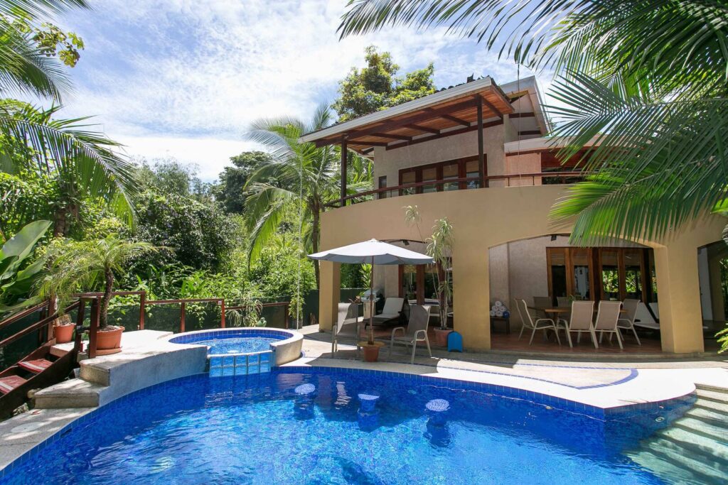 The carefully-maintained jungle gardens surround the beautiful villa to create a little beachfront paradise.