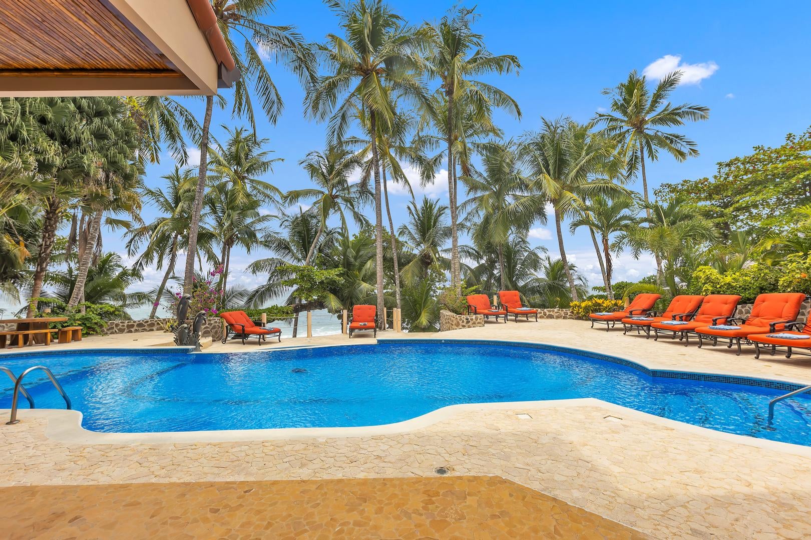 Private beachfront pool terrace at a luxury vacation villa in Playa Tambor, Costa Rica.
