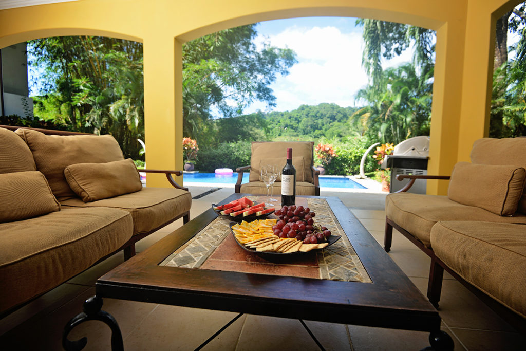 Nestled by the pool, this inviting outdoor sitting area offers comfort and serenity, perfect for engaging conversations.