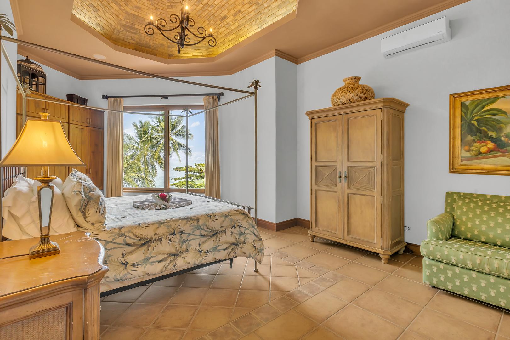 King bedroom with ocean views at a luxury beachfront vacation villa in Playa Tambor, Costa Rica.