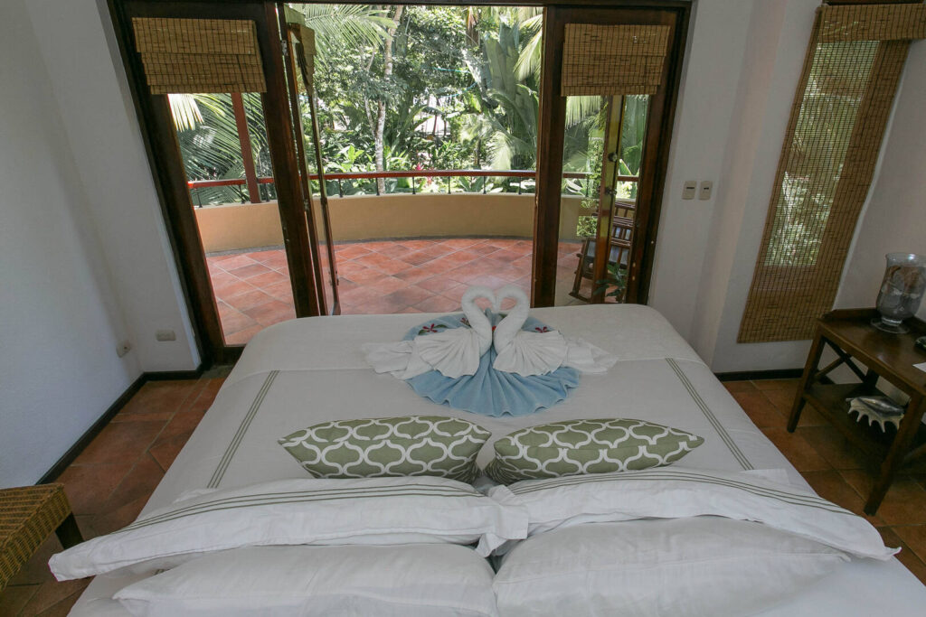 The sounds of the surf can be heard through large open bedroom doors.