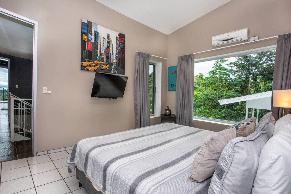 Rainforest views, a TV, and a reminder of the hustle and bustle you left behind ... a great bedroom for your getaway!