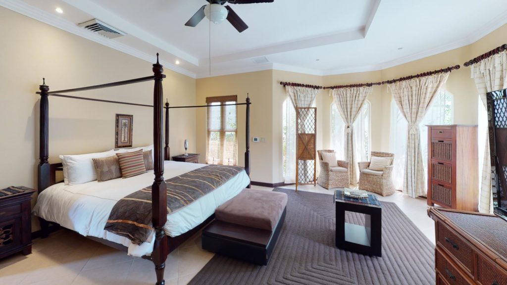 This large, exquisitely-decorated bedroom exudes romance and elegance, and its sitting area has gorgeous jungle views.
