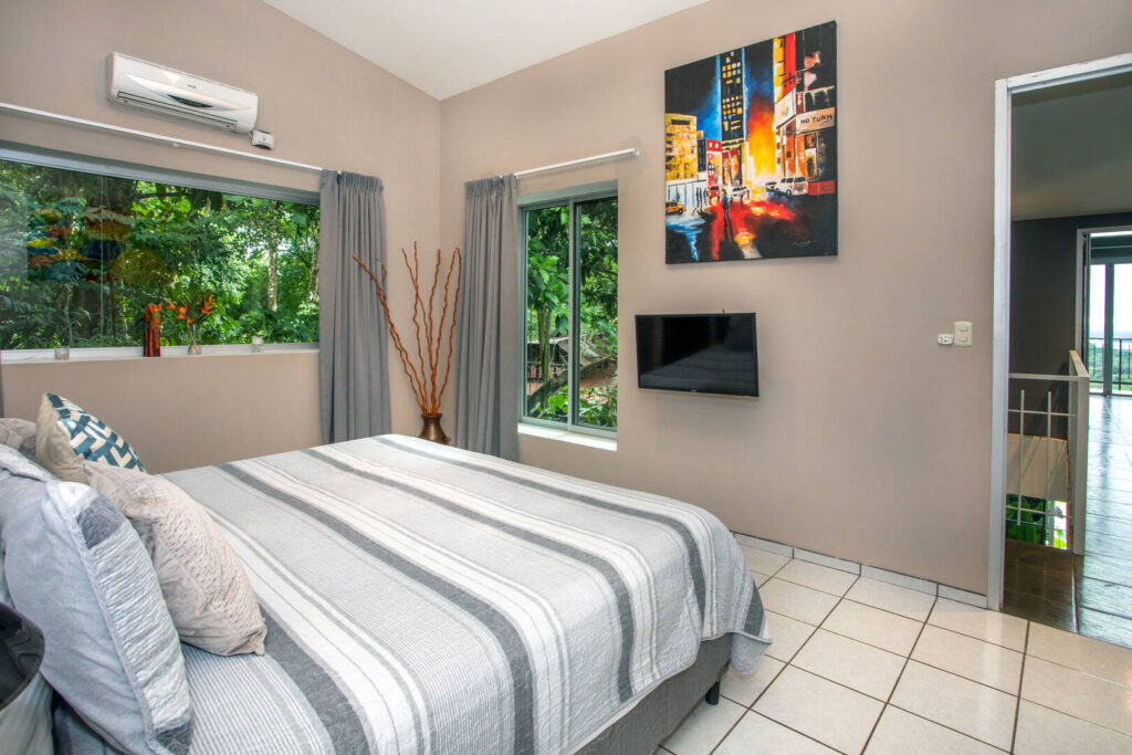 All the bedrooms are beautifully designed with neutral decor and vibrant artwork.