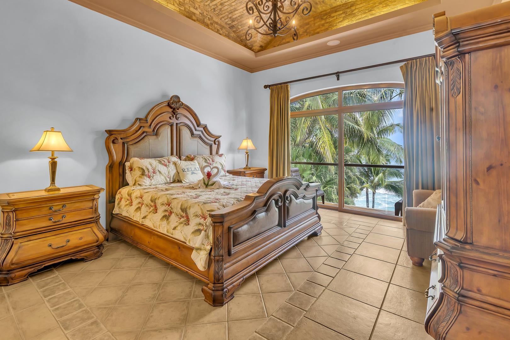 Luxury master bedroom with ocean views in a beachfront vacation villa in Playa Tambor, Costa Rica.