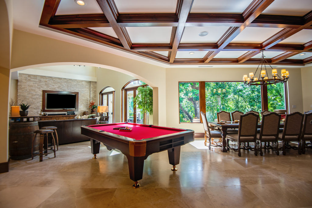 This luxury vacation villa features the perfect entertainment space with a pool table for hours of leisurely enjoyment.