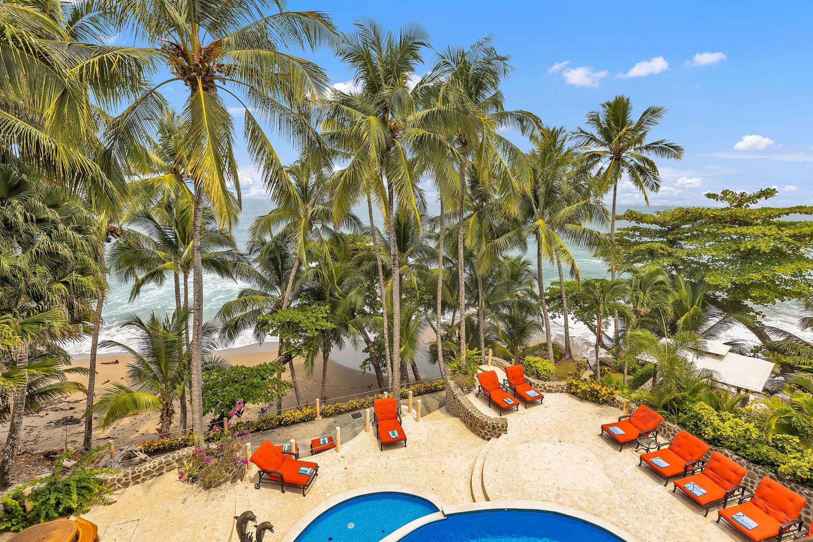 Oceanfront pool terrace with Pacific Ocean views at a luxury beachfront vacation villa in Playa Tambor, Costa Rica.