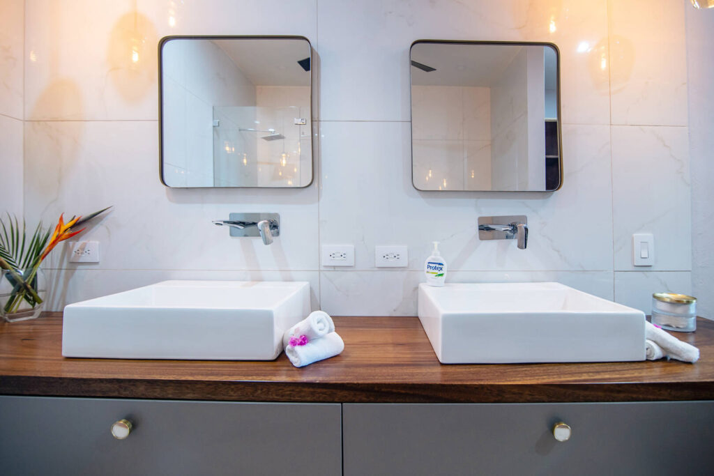 Simple elegant and luxurious his and hers sinks.