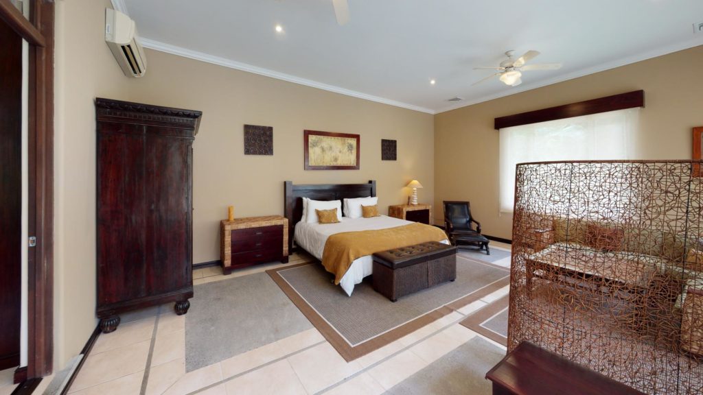 Refined luxury in this large, exquisitely-decorated bedroom, graced with abundant sunlight.