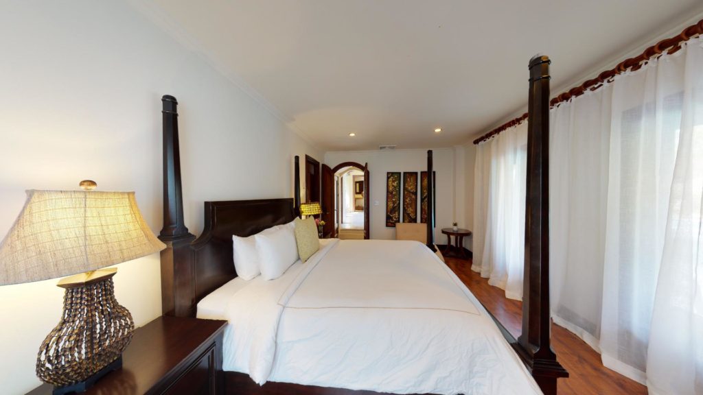 The fifth bedroom boasts a King-Size bed, a spacious bathroom, and direct access to the pool area and enchanting gardens.
