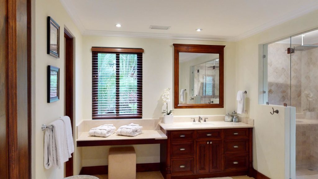 A spacious and elegantly designed bathroom featuring a generously sized shower.