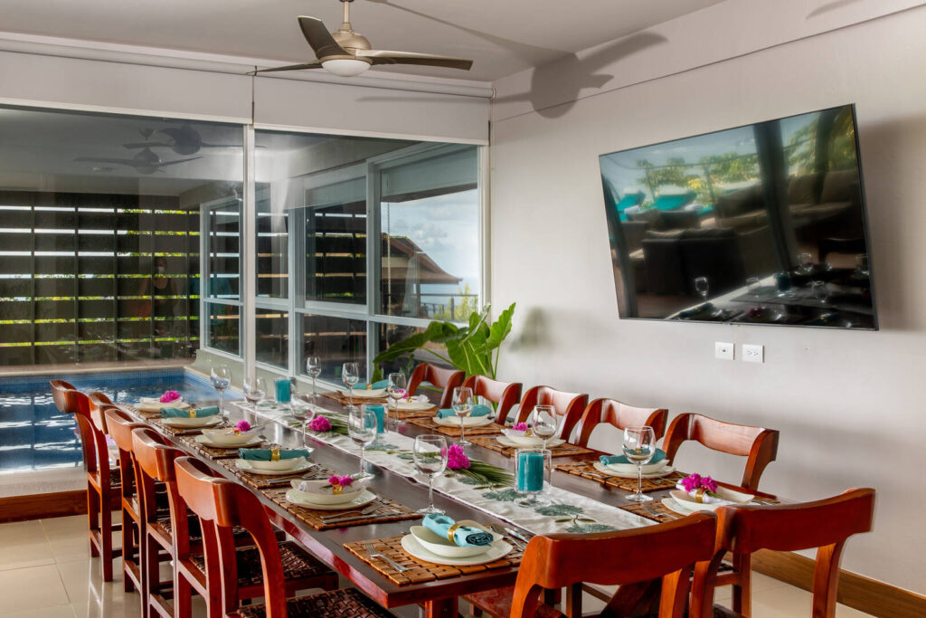 Fourteen guests can comfortably eat together at this huge luxury wooden dining table.