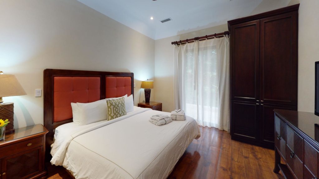 Exquisitely furnished, this bedroom features a Queen-size bed.