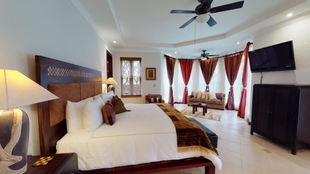 Experience a blend of romance and refinement in this large, beautifully-adorned, air-conditioned bedroom.