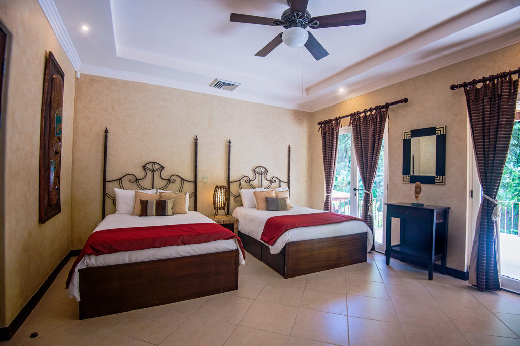 This luxury family villa offers a cozy bedroom for younger guests.