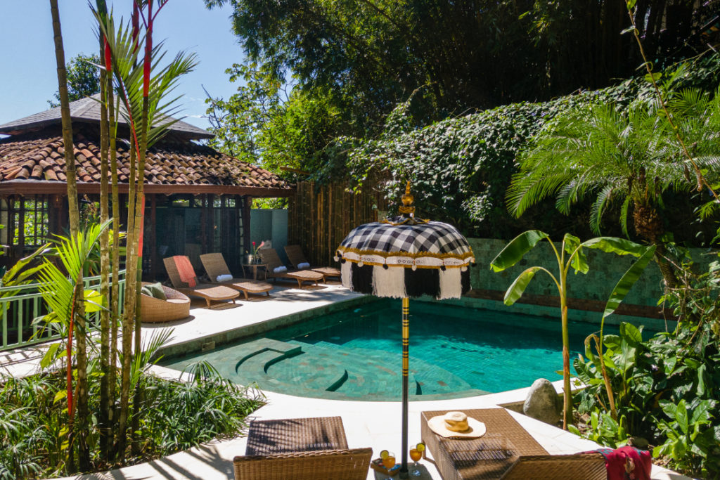 A chic and secluded pool lounge area.