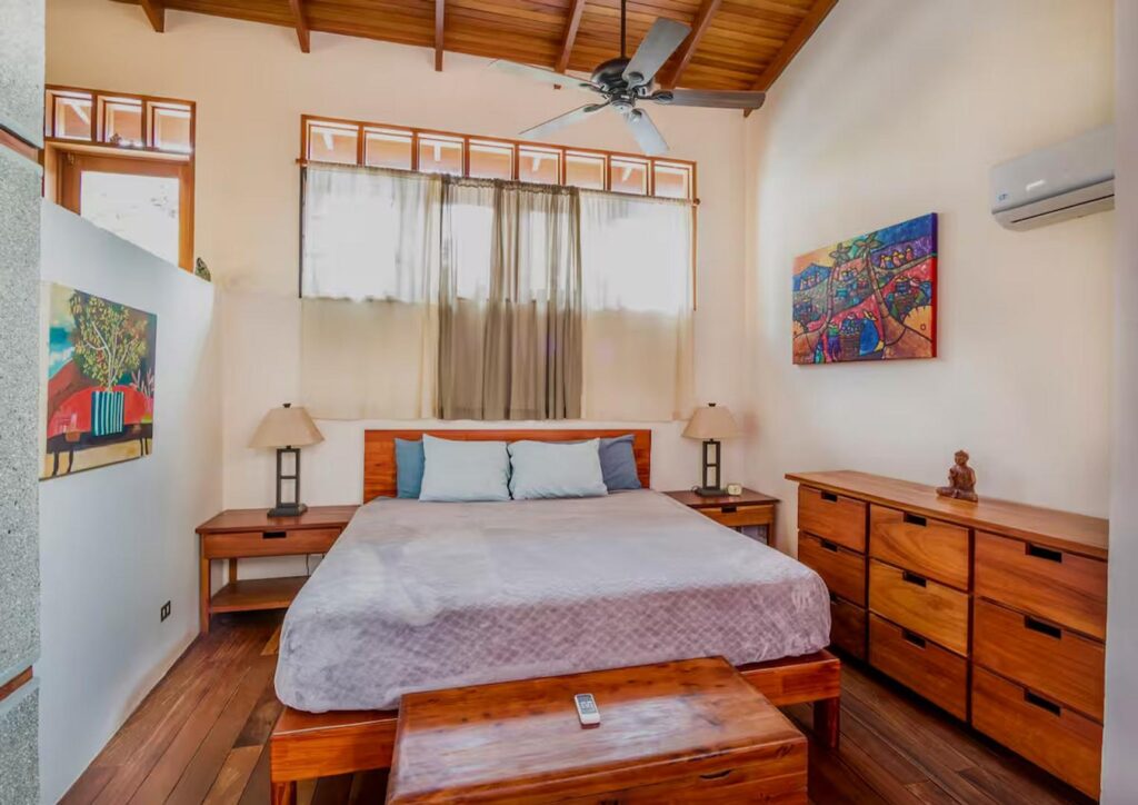 This large bedroom features a king bed and has plenty of storage space.
