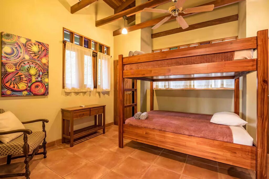 A queen-size bunk bed makes this bedroom perfect for kids - of all ages!