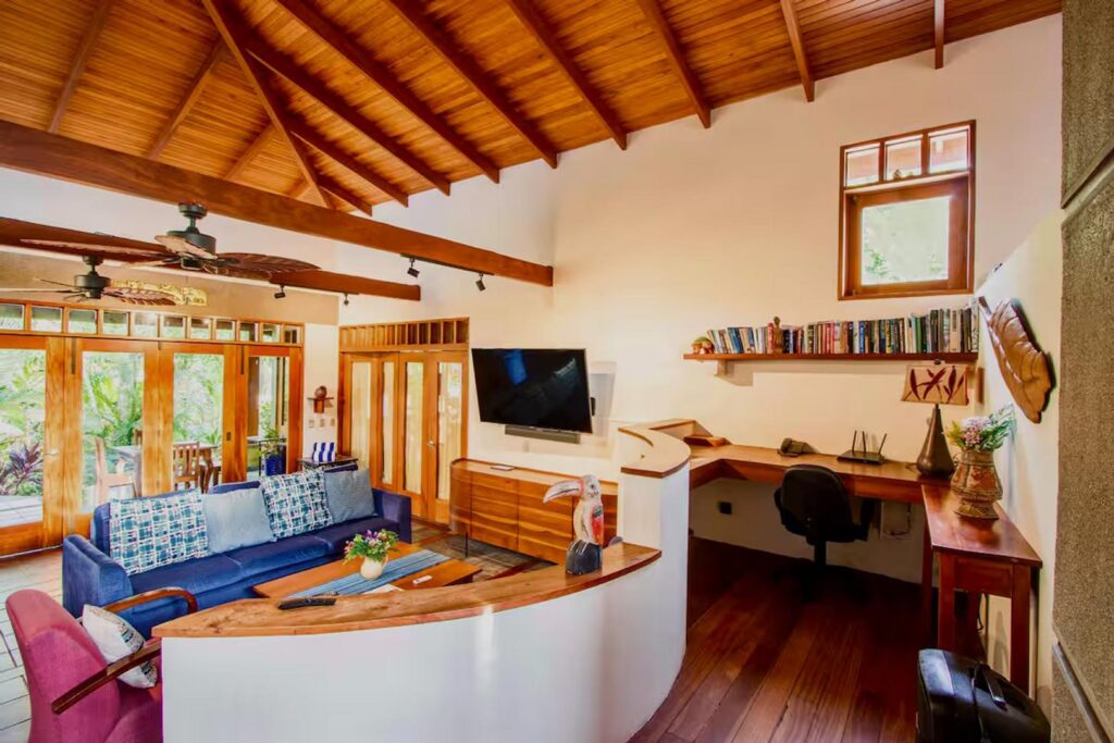 The open living space of this incredible home even includes an office area if someone needs to work a little.