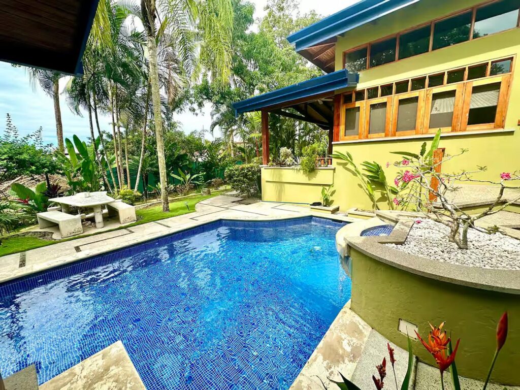 The pool has a waterfall and the property is close enough to hear the waves rolling onto Jaco beach.