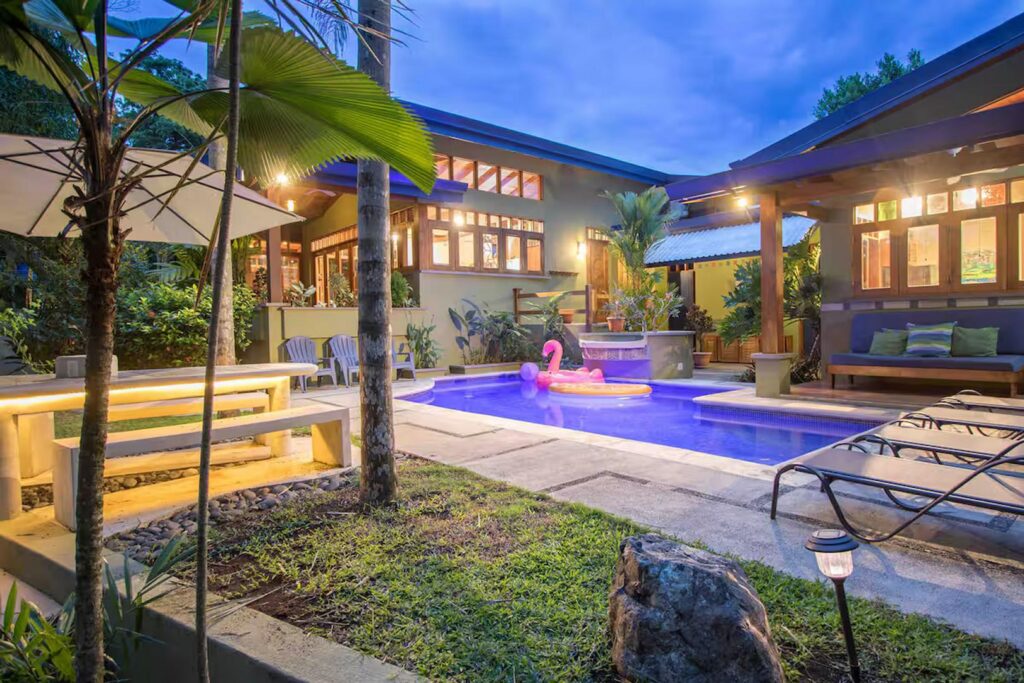 In the evenings, the villa and pool come to life with warmly inviting lighting.