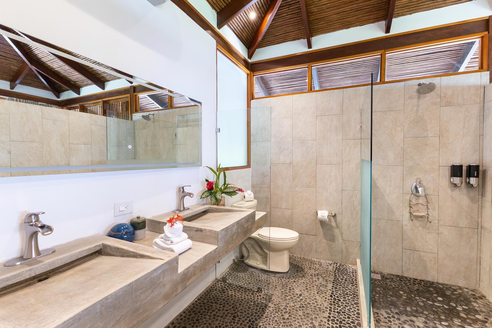 Luxury villa bathroom with double vanity sinks and walk-in shower in Manuel Antonio Costa Rica