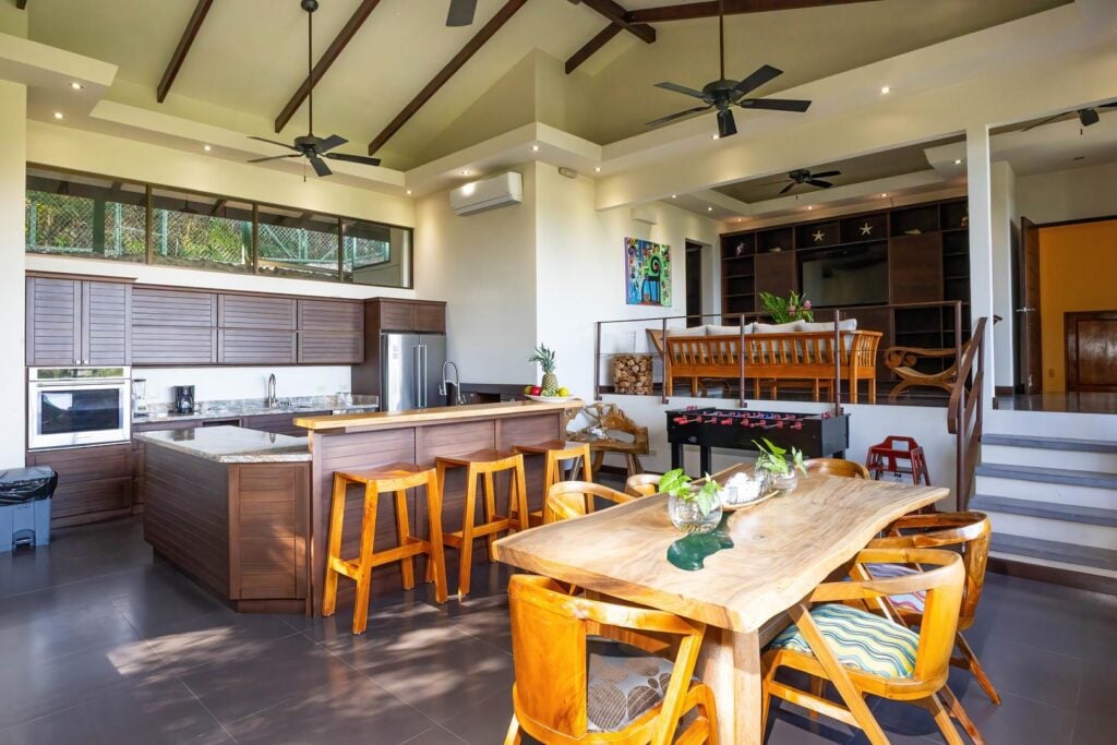 The Sky Suite has a generous open-plan living area that brings together the kitchen, dining space, and entertainment area, creating a comfortable setting for spending time together.