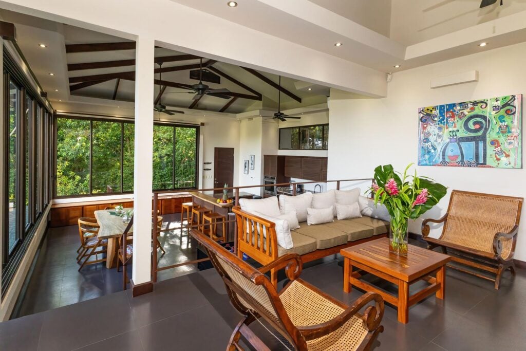 The Sky Suite has an inviting upper-level lounge with open views across the home, providing a comfortable place to relax and spend time together.