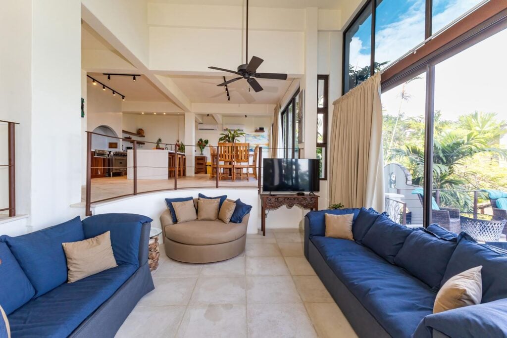 A comfortable sunken living area with soft seating and open sightlines, offering an inviting space to relax and spend time together.