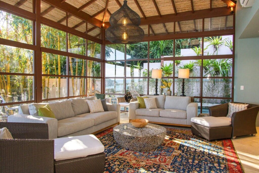 fully air-conditioned Family-friendly seating area in the new wing living room with vaulted ceiling and jungle views