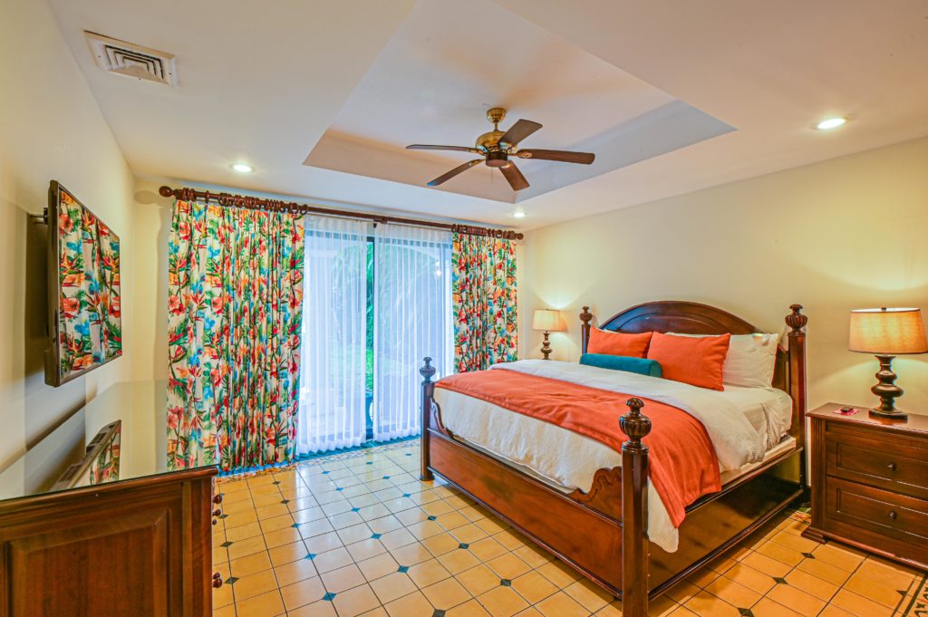 This bedroom exudes a natural allure and tropical charm, providing a breathtaking space to awaken in each morning.