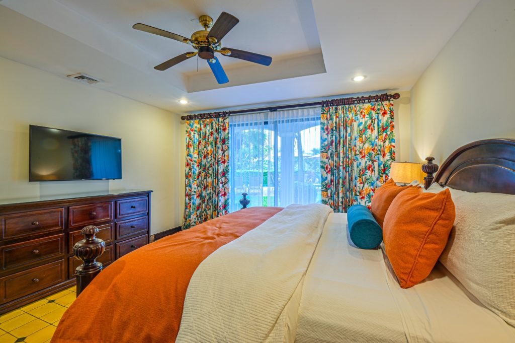The first master bedroom features a king-size bed and provides stunning panoramic views.