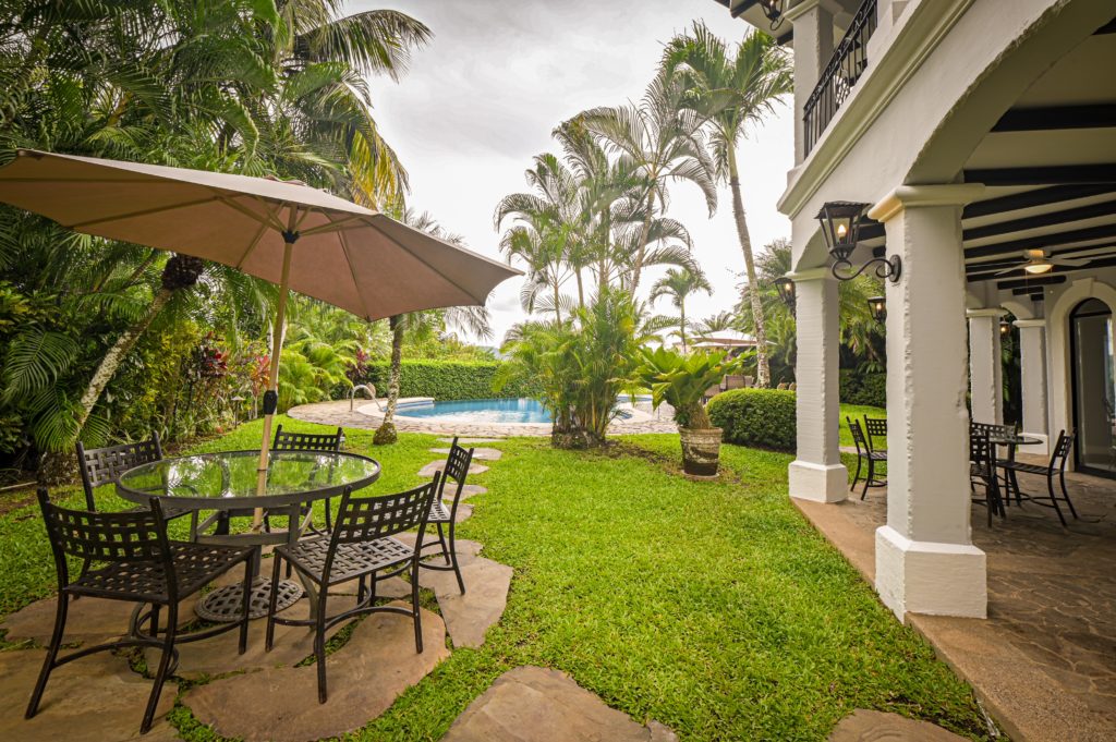 The patio area is surrounded by stunning exotic tropical landscapes.
