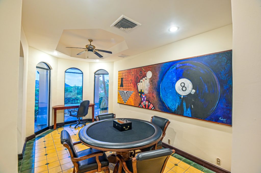 Vibrant art and a colorful poker area create a lively environment for social gatherings.