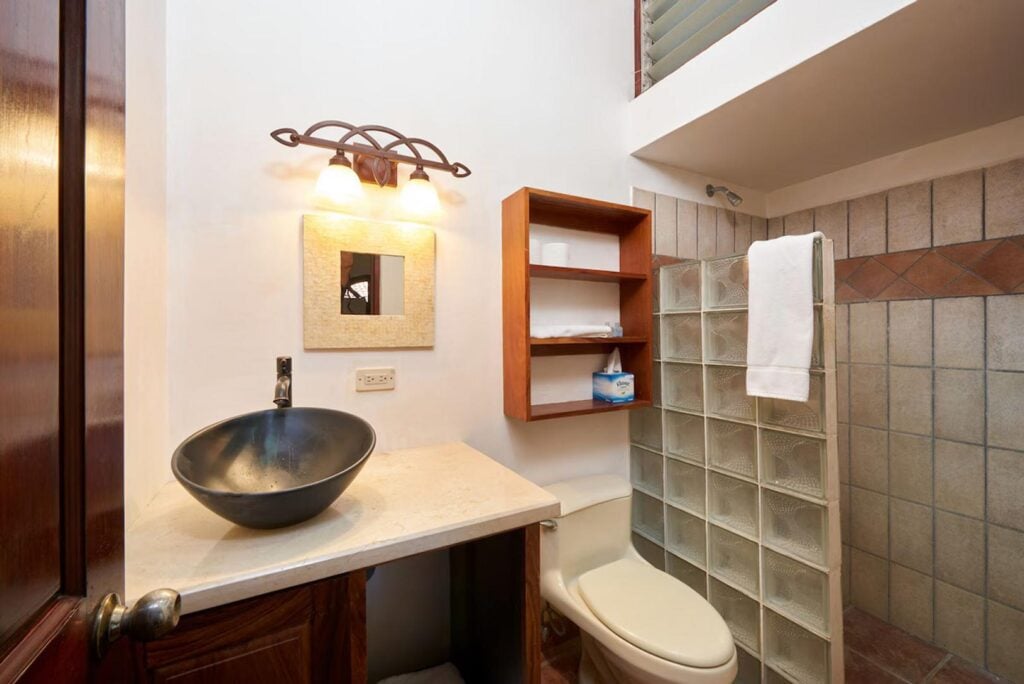 The elegant ensuite bathrooms in this vacation home offer privacy and convenience.