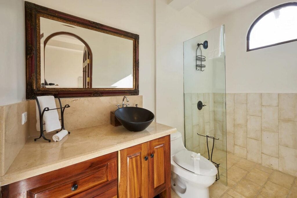 The bathrooms throughout the villa feature attractive granite surfaces and tilework.
