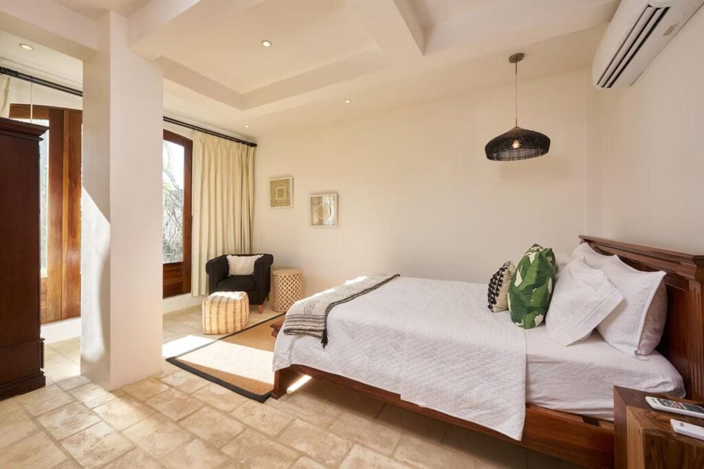 Chill in your luxurious bedroom with air conditioning and a wooden queen bed.