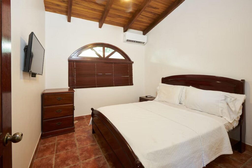 The main guest bedroom in the casita has a queen bed. ensuite bathroom, air conditioning and a TV. 