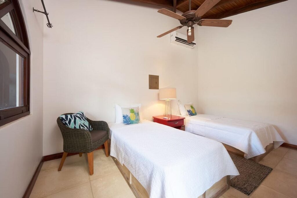 The two single beds in the second bedroom of the secluded casita can be joined to create a king bed.