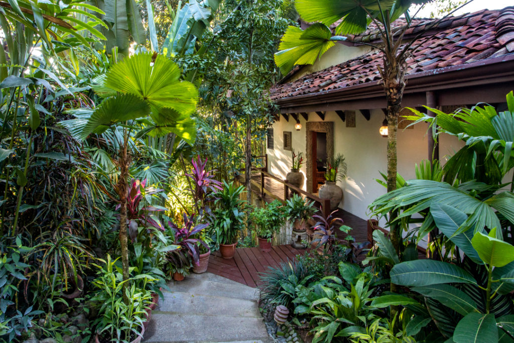 This beautiful vacation home is surrounded by lush tropical gardens.