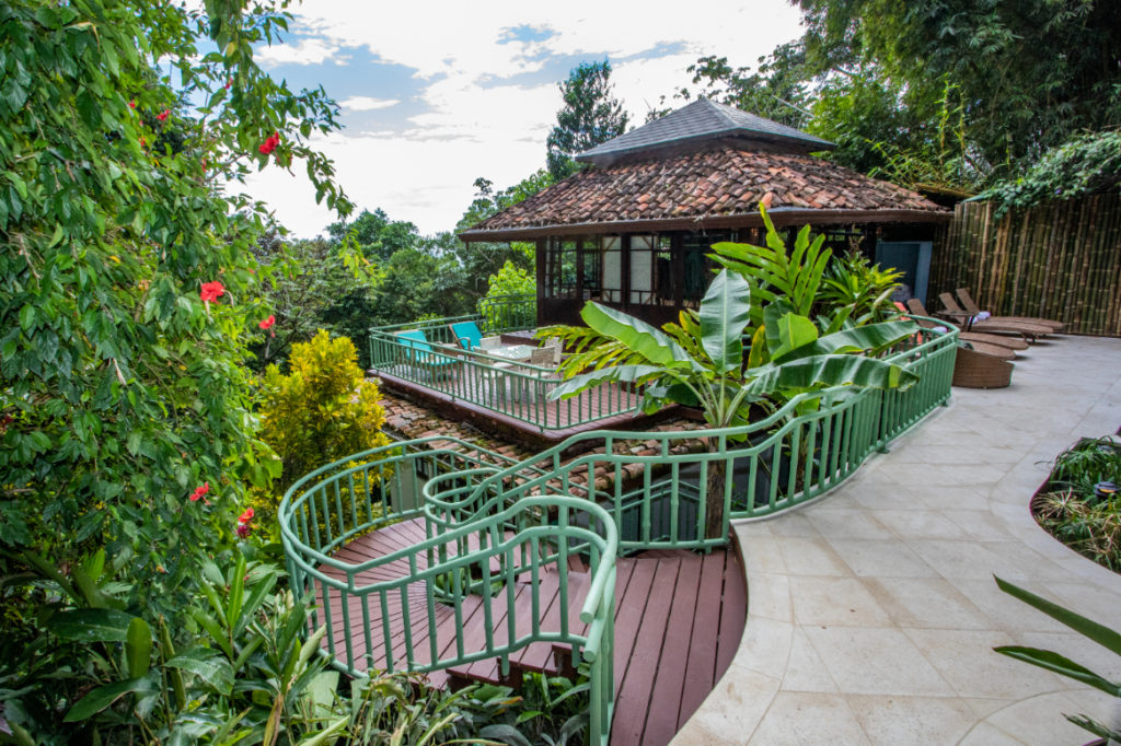 Tucked within exotic gardens, the pool house offers seclusion and tranquility.