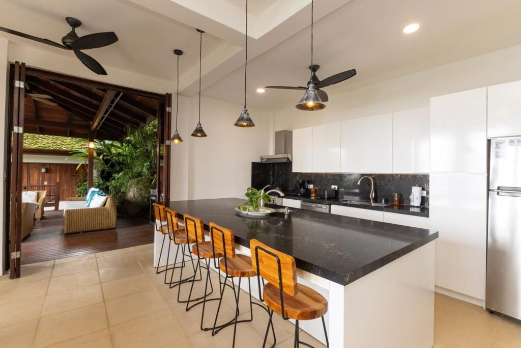 Modern fully equipped kitchen with a jungle view