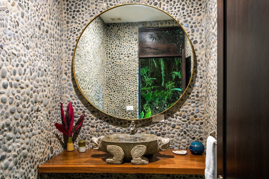 The designer bathroom off the pool deck is no ordinary bathroom and is full of unique decor. 