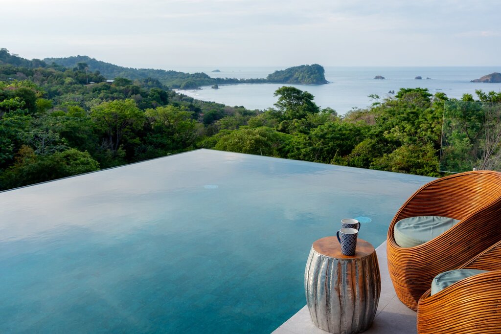 Admire the breathtaking panorama from the refreshing infinity pool as it merges into the ocean view.