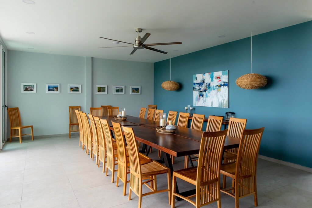 The luxury dining room features a large wooden table with enough seating for your whole group.