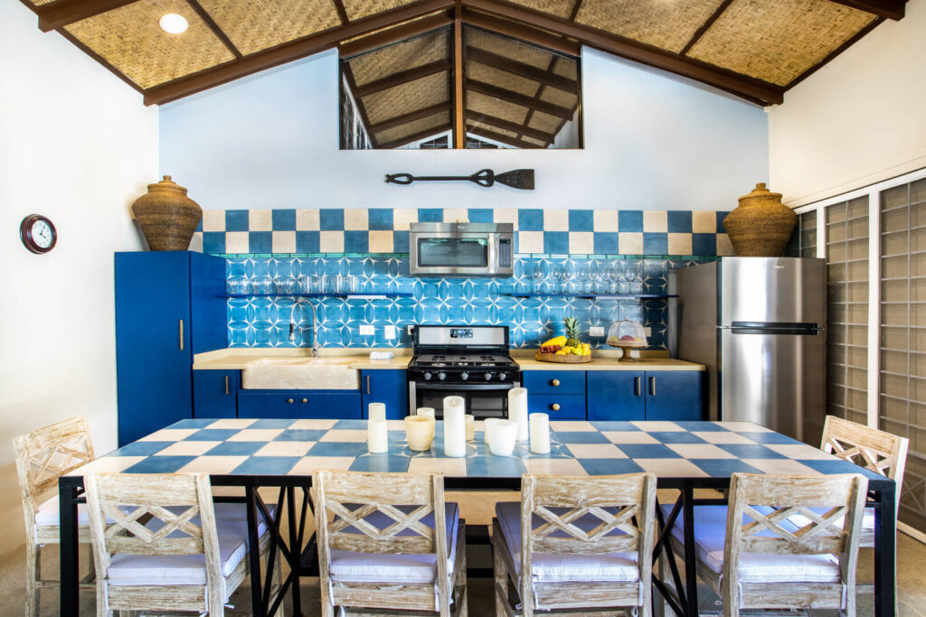 Modern design, a tropical feel, and colorful accents create a unique kitchen in this new Manuel Antonio villa.